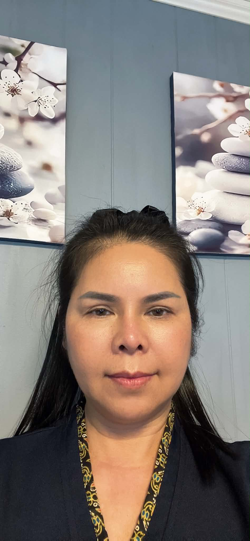 Professional studio headshot of Faa Hagen, massage therapist